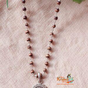 Silver Flower Capped Tulsi Beads with Jagannath Pendant - Classic Necklace