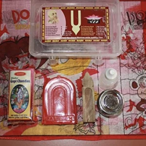 The travel set includes gopi chandan, tilak stamp, mirror, bottle for water, some box (Dibbi) and handkerchief.