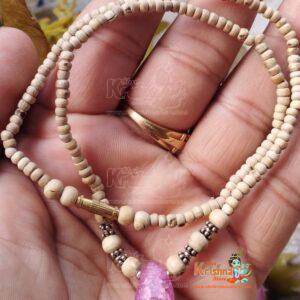 Shop a handcrafted Tiny Beads Kanthi Mala adorned with original stones. Perfect for spiritual devotion and traditional style. Elegant and durable design.
