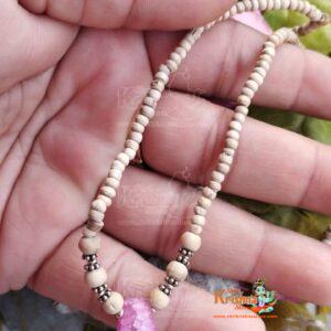 Shop a handcrafted Tiny Beads Kanthi Mala adorned with original stones. Perfect for spiritual devotion and traditional style. Elegant and durable design.